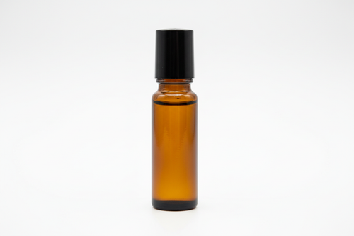 1/3 fl oz amber glass roller bottle with black cap. white background