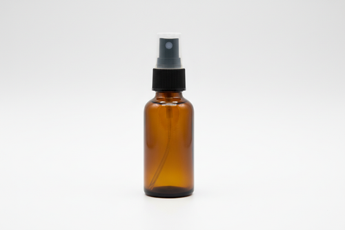 2fl oz amber glass spray bottle on white background